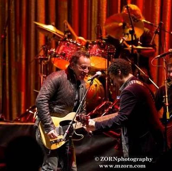 Gabriel Gordon sharing stage with Bruce Springsteen, 2012
