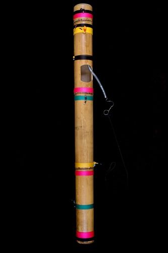 “Lightning Rod,” bamboo, nylon cord, plastic cup, steel spring, beads, nut and bolt.
