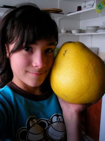 It's the size of her head! A yummy mellow citrus fruit.
