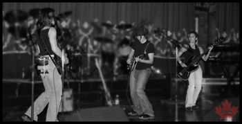 2004 -YUKON->: L to R: Kristen Starra, (Raven on drums), Matti Ardison, & Roxy DelMonaco at the Oriental Theatre. , Denver, Colorado
