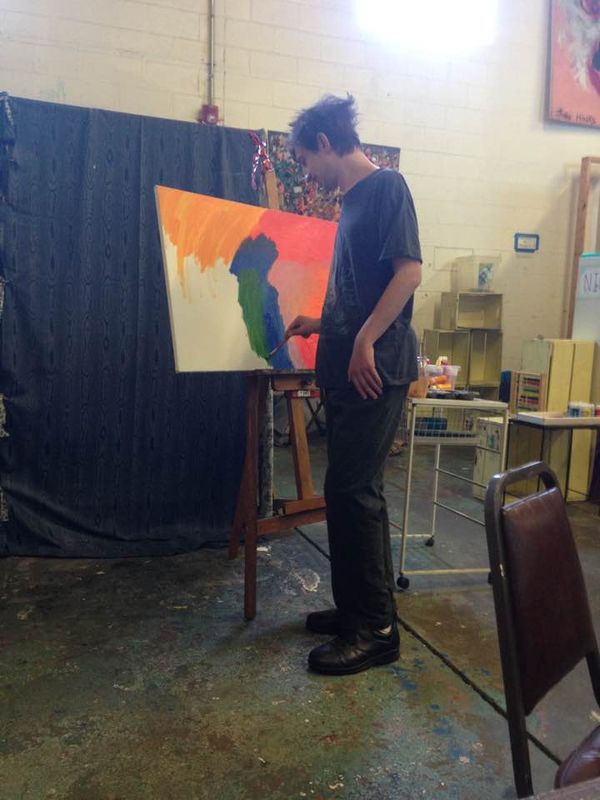 Nick Morse in motion at the Outside the Lines Studio, his art day program in Medford.