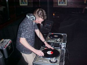 Me DJing Hip Hop on vinyl in a bar called Magnums in Scottsdale, Phoenix, where I used to live in the early 2000s when Hip Hop was at it's peak.

Notice the laptop on my left. Even back then I had already realised how powerful laptop DJing was and was supplementing my vinyl collection with the odd hard to find track on mp3 or CD. 