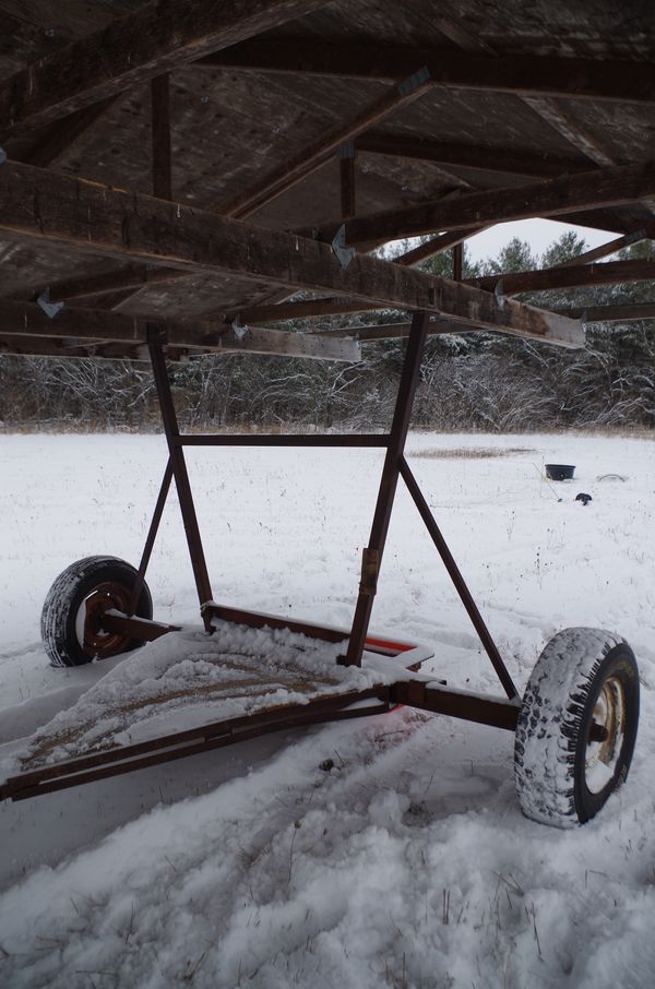 The mobile shelter has weathered 100 mph winds without any sign of overturning. The rear axle has been  extended to three metres (about 10 feet) by cutting the original axle in half and welding a new middle.  The diagonal steel supports from axle ends increase rigidity in the steel frame. 