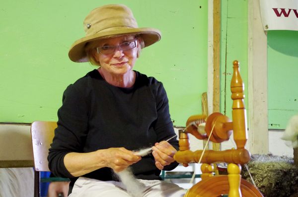 After the wool has been washed and carded, Kate spins some on a wheel. Much of the wool is processed into skeins at Wellington Fibres (click on photo).