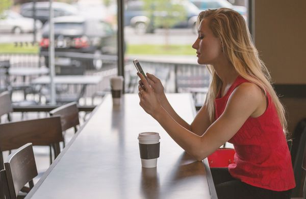 Woman watching a music video on her phone