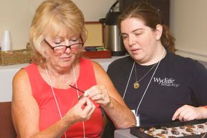 Lydia Weatherbie (R) teaches wire-wrapping for Road Scholars at YMCA Trout Lodge.