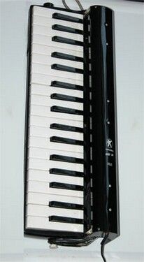 This is the Hohner 36 melodica that Paul uses with a Hohner melodica pickup, Hohner doesn't make the pickup anymore. Paul firsrt recorded the melodica in the blues in 1971 on Muddy Water's album, Live at Mr. Kelly's.
