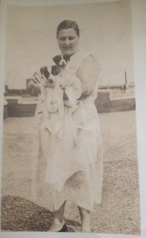 My mom, Ruth Grohmann, with her neighbor's pups.  This was most likely taken in the early 1930s in New York City.

Submitted by Lois Grohmann Hansler