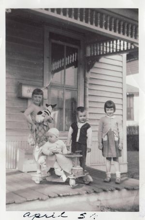 1956 photo from Jefferson, Iowa of me with my siblings.  I am holding the Rat Terrier that belonged to a neighbor.  There was never a dog or cat that I could resist.  Photo was taken by my mother.

Submitted by Sandra Ball