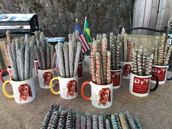 Promotional mugs and sage sticks that were made with sacred sage from the Mount Shasta area.
