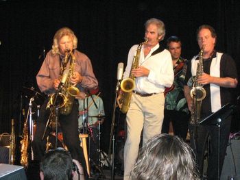 Four saxaphones, but only three players!
