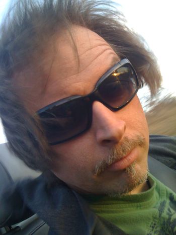 Riding in a convertible when I was growing my hair longer a few years ago.
