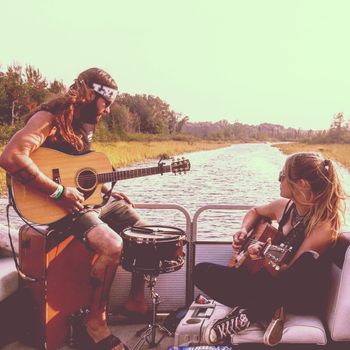 Matt Ferris and I playing some tunes on a pontoon. Occasionally, Matt will play drums for me at my shows.  Always fun times.
