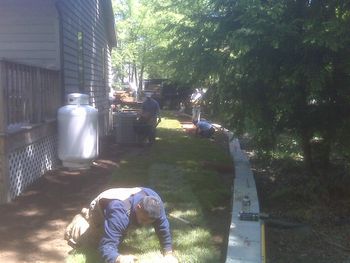 RETAINING WALL, SOIL AND SOD INSTALLATION
