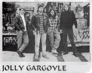 Jolly Gargoyle on the roof of the Nyabinghi, Morgantown, WV 1993.  Gregg Lowley, Chris Ramey, Mike Pushkin, Matt Voth.