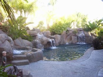 Completed new construction of pool rock formation with features on.
