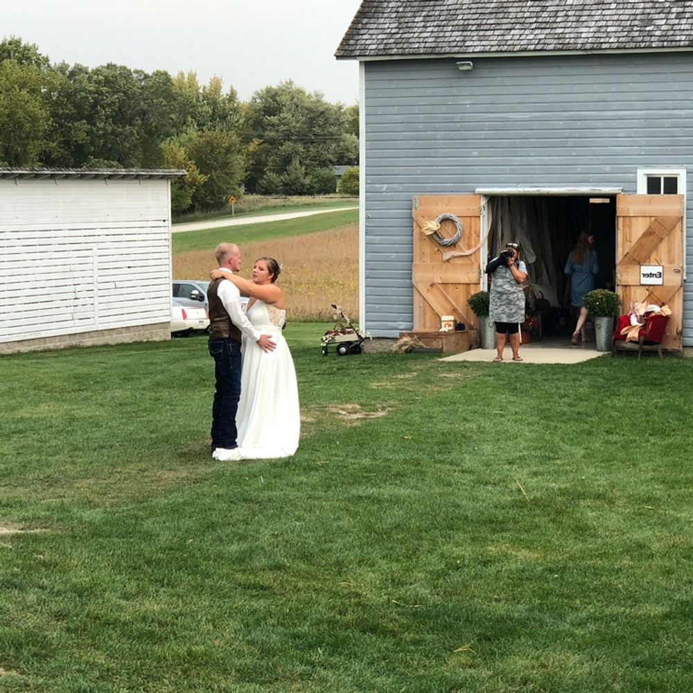 couple dancing their first dance at an outdoor wedding