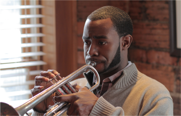 Eliezer Emmanuel "Eli" Brooks was born in Detroit, MI.  He was first introduced to the trumpet by Howard House at the age of eight at Birney Elementary.  He was then later taught jazz by Nathaniel’s brother, Ryan Felton. During a high school visit by trumpet virtuoso Wynton Marsalis, Eli received his first trumpet from Wynton.   His life then was even more devoted to music.  He is currently a senior at the University of Michigan in Trumpet Performance. Although he gave up a social life to obtain musical perfection, Eli has been able to finally find love in Alexandra Hylton, a MBA student from Mississippi.  He is also supported immensely in all his musical endeavors by his childhood friends Nathaniel, Omar, Pearl, and Lynn.