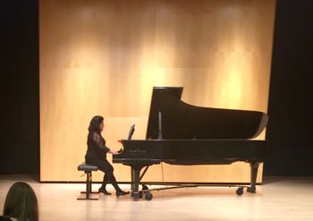 Performing a Haydn sonata movement at a piano teacher and student recital.  I also teach piano.
