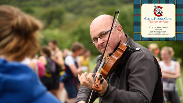 This is Colin in action at the Resipole Fiddle Fest in Scotland. A hill race of over 100 hill runners is about to start and they are being serenaded by musicians from the Resipole Fiddle Fest Weekend.
