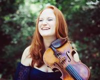 “Natalie Gain brings her own style of fiddling and vocals to the stage. With her high energy approach you can expect to hear a wide range of material from bluegrass to country and Gospel music. 