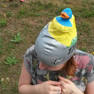 me with a swimming cap and rubber duck on head