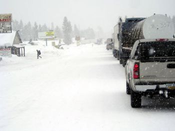 2006-We just returned from Sun River, Oregon. What a beautiful
place. We didn't see much sun, however! Yes, there is a road
somewhere under the vehicles. We had a jack-knifed big rig
just ahead of us
