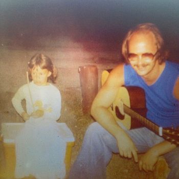 Me & My Daddy singing, hangin' at the camp fire. He inspired me to be the musical artist I am today!
