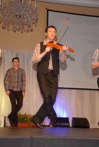 Dancing and playing the fiddle at the An Comhdhail ulsters in 2011