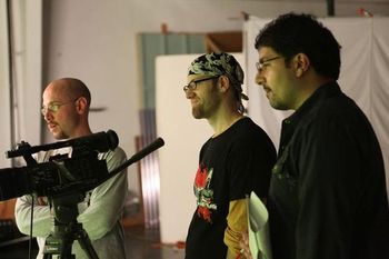 Producers Marx, Jake, and Joe watching a scene rehearsal.
