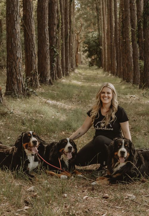 Co-owner Zoie with her Mountain Dogs Kora, Fallon and Saxon