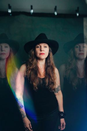 Americana musician Sarah King in western hat and black tank top
