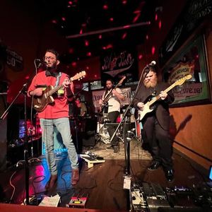 Yuppie on stage at Blind Bob's bar. Zack Sliver is on the left (stage right) playing guitar