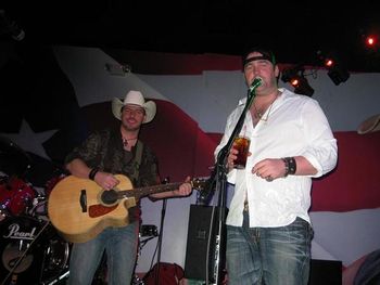 Chad and Lee Brice on stage
