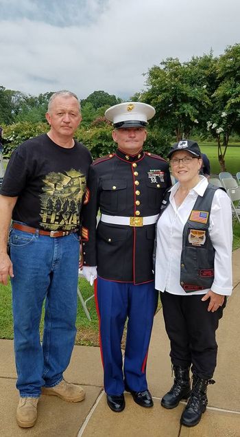 Husband Sgt. Byerly (left), Tim Chambers, Saluting Marine (center) & Ann at Chattanooga 5 Memorial Service, Veterans Cemetery
