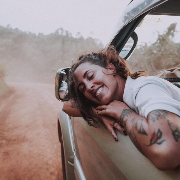 Charlotte Archer Happy in a car leaning out the window