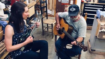 Marina jamming with world famous luthier and guitar player Wayne Henderson at his shop in Rugby, Virginia. Marina is playing the first F-style mandolin Wayne ever made.
