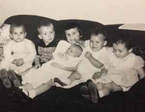 Group of young cousins on the couch.