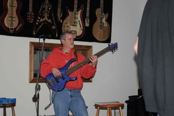 Mark anchors the band with his bass.
