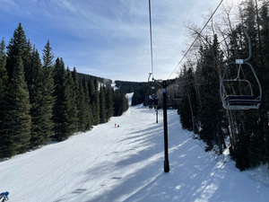 Matt Kollock Skiing Chairlift Perspective