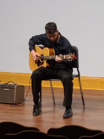 Ryan playing an original song during his senior recital ( April 2022)
