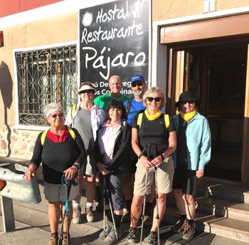 Pilgrims posing after obtaining passport stamps to prove they walked the Camino
