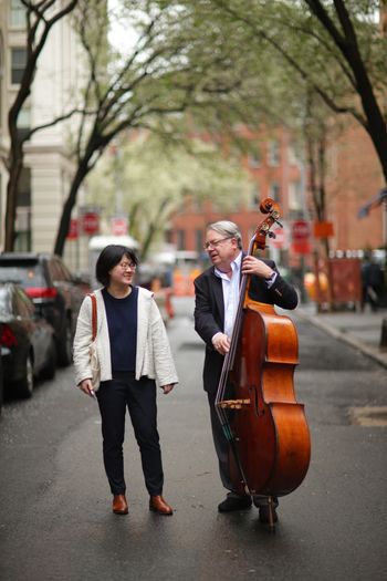 Playing bass in the middle of a NYC street is a great way to meet people.
