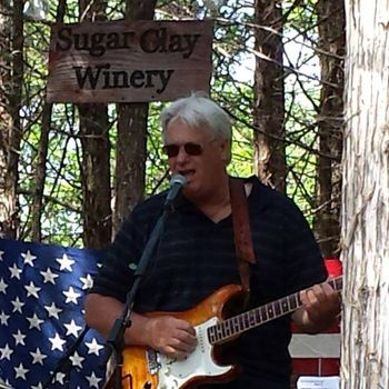 Me playing with friends at Sugar Clay Winery
