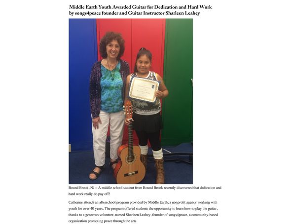(l-r) Sharleen and Catherine, a guitar student from the Middle Earth afterschool program in Bound Brook who received a songs4peace scholarship for her dedication to her guitar studies.