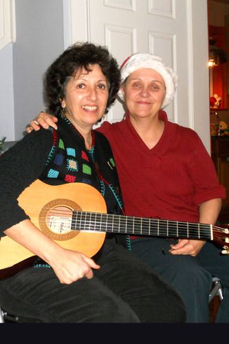 (l-r): Christmas Day 2011 with Carol Levasseur, artist, gardener, animal rescuer, songs4peace photographer, videographer, peace and justice activist . . . and a living angel who was by my side for almost ten years. Still  hard to believe she has left this world. The water is wide.
