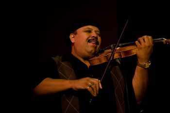 Master Violinist Carlos Reyes inspiring solo.
