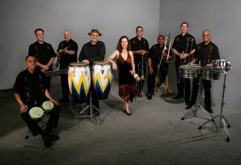 This photo by Stuart Locklear (2007) is featured on the back of the latest Cd "Celebrando 20 Años." Pictured, left to right: Julio Areas, Bob Karty, David Belove, Edgardo Cambón, Sandy Cressman, Marty Wehner, Abel Figueroa, Jeff Cressman and Omar Ledezma.
