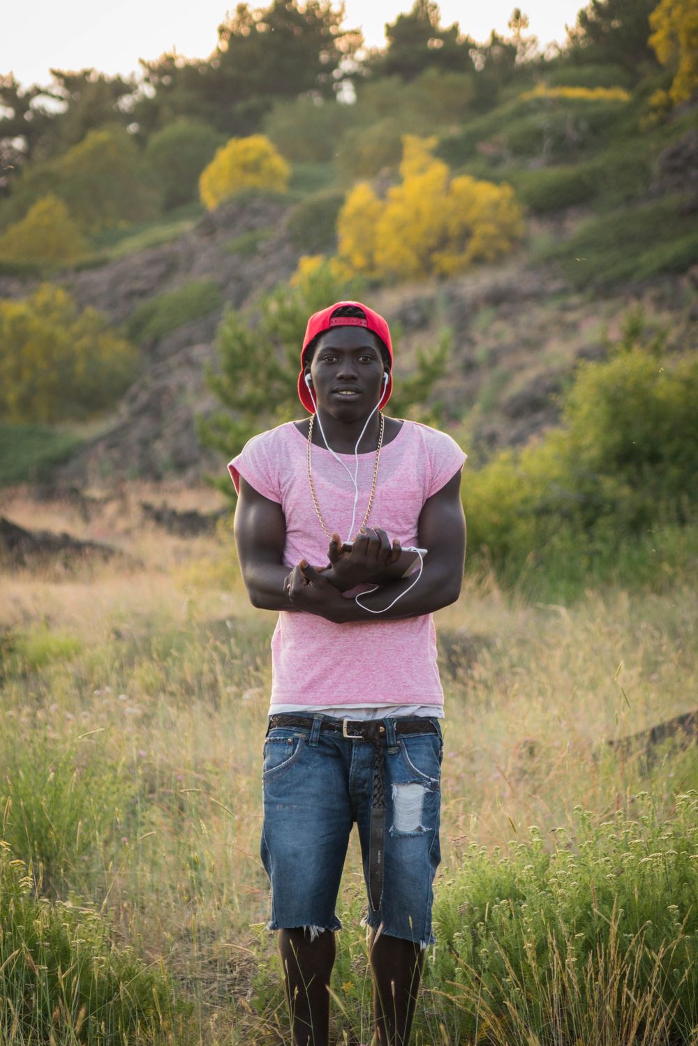 Sayou Fatti – July 2017, Mount Etna, Sicily. Sayou, an 18-year-old Gambian, listens to music on his phone in the highlands of Mount Etna before performing a concert at an NGO retreat.