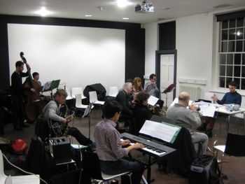 Rehearsing during early 2015 at The Bluecoat, Liverpool for a Mindset Ensemble performance, find Mark Jones donning the glasses as on flute in the far distance of this shot, accompanied and conducted by Merseyside's top improv. artists...
